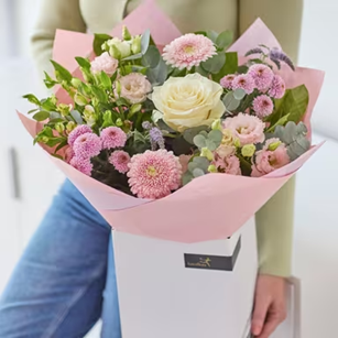 (Interflora) CCHTP0200I Pastel Hand-tied Bouquet - €62.00 + C16471ZFI Classic Chocolate Collection - 99g Single Layer Box - €12